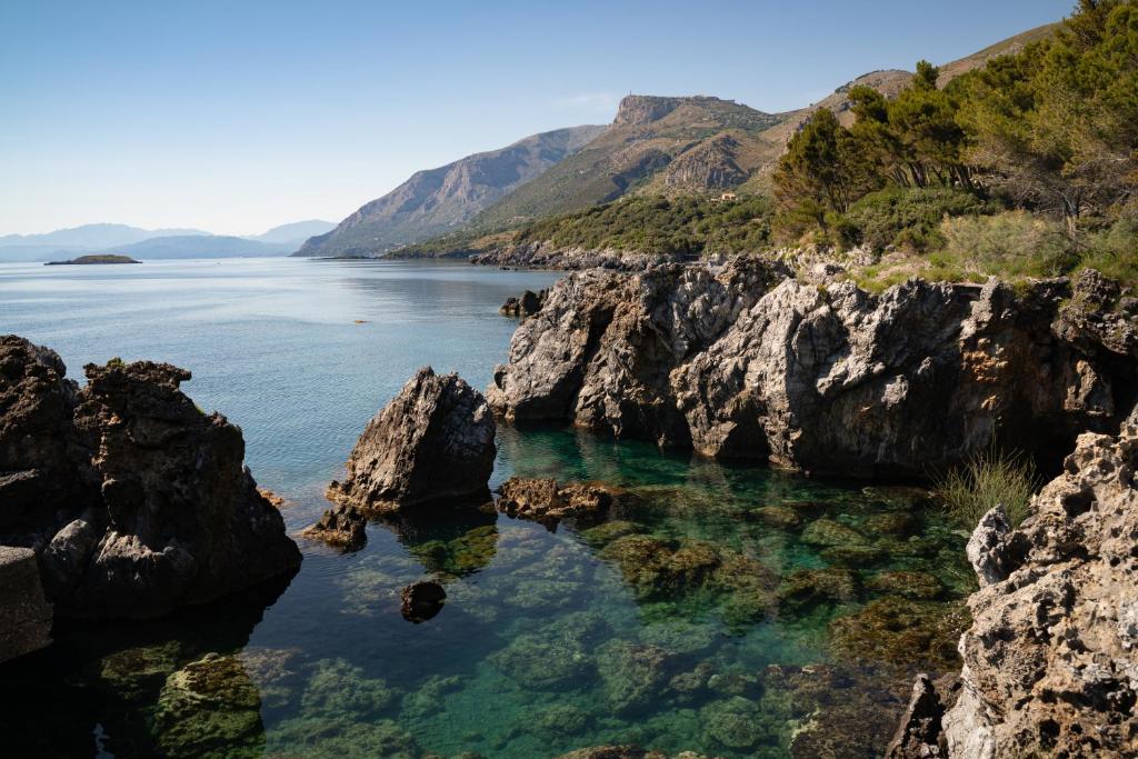 a view of a body of water with rocks at Amaranto in Maratea