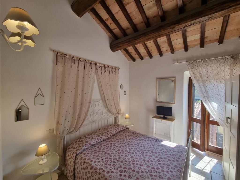 Postel nebo postele na pokoji v ubytování Appartamenti San Francesco