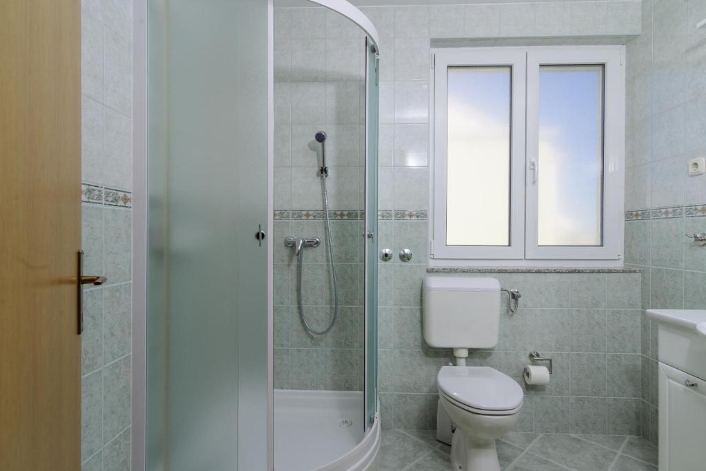 Kúpeľňa v ubytovaní Apartmani Emil