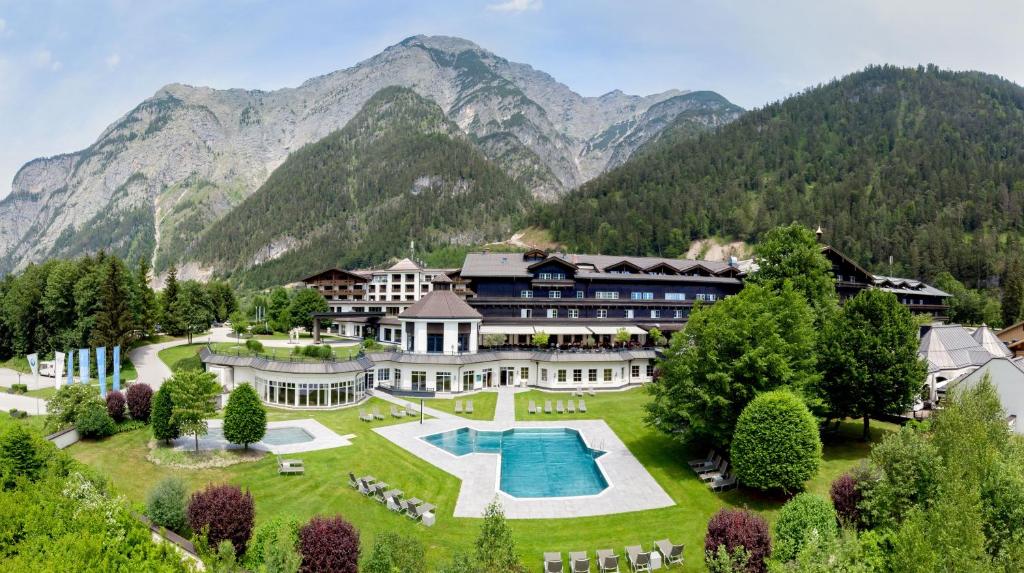 an aerial view of a resort with mountains in the background at Hotel Gut Brandlhof in Saalfelden am Steinernen Meer