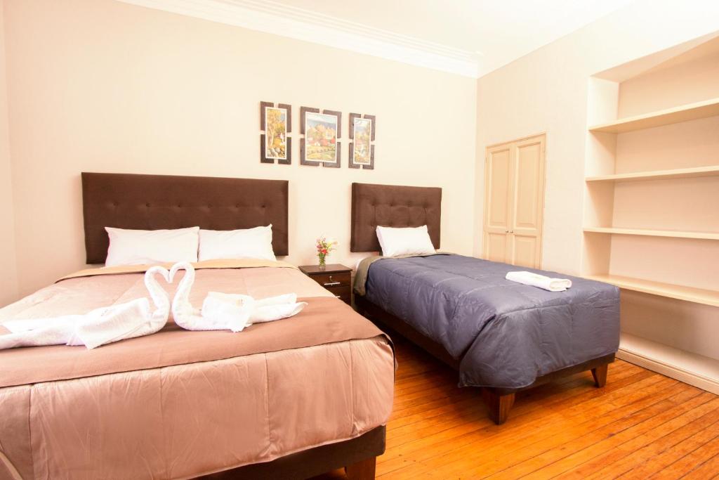 Postel nebo postele na pokoji v ubytování Hostal Virreinal AQP