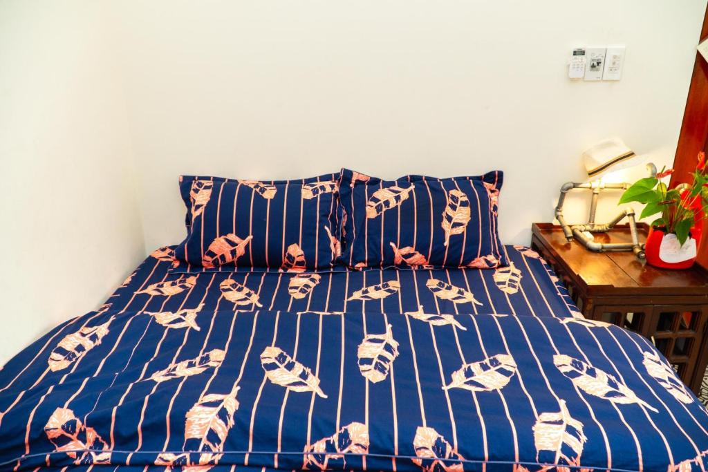 Giường trong phòng chung tại Hue Eco Homestay
