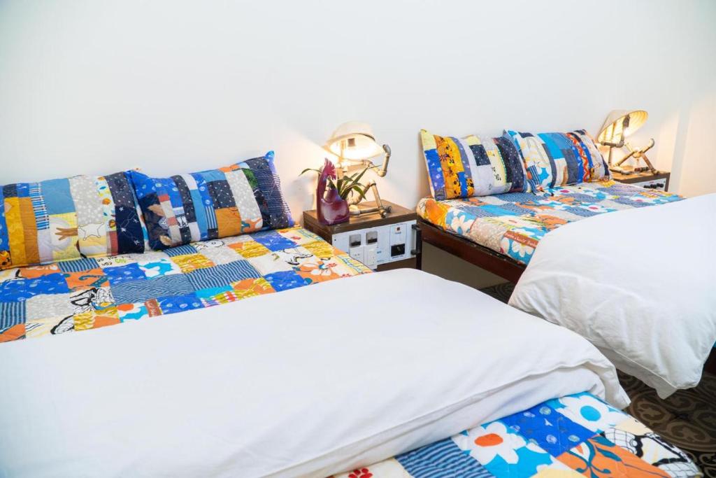 Giường trong phòng chung tại Hue Eco Homestay
