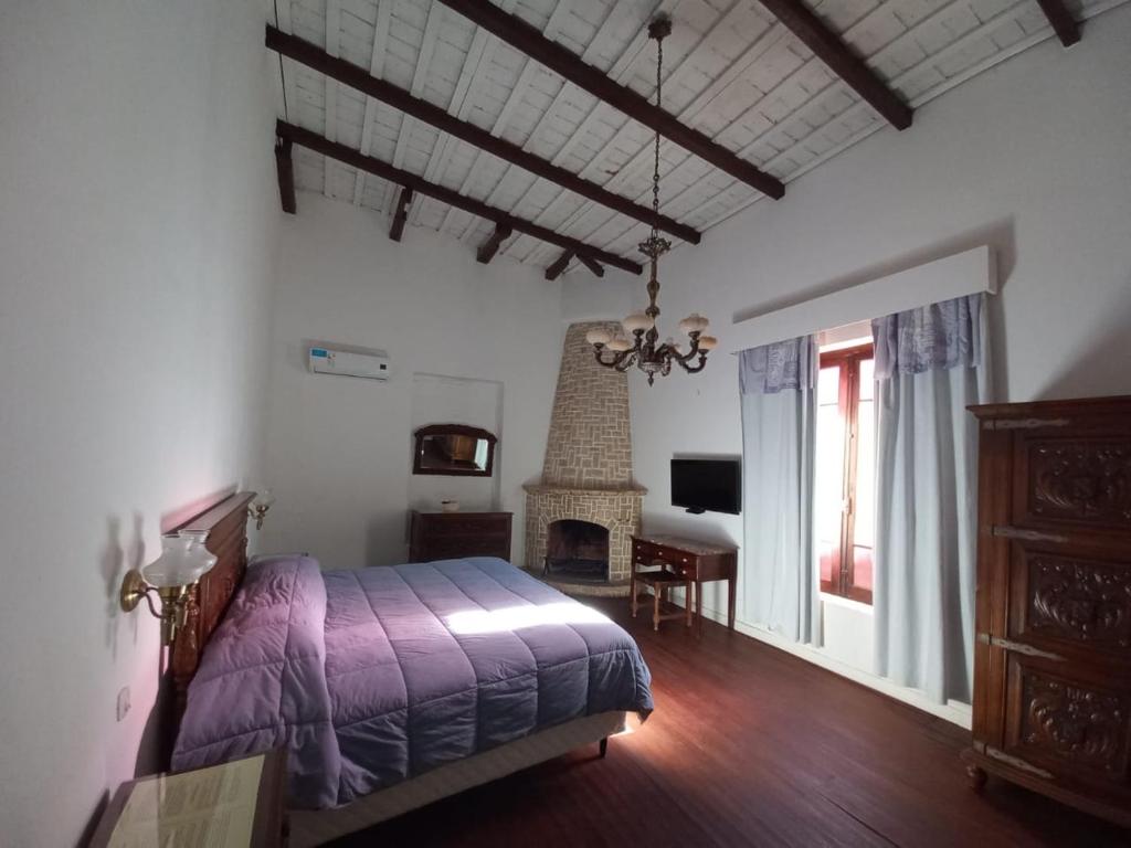 Ένα ή περισσότερα κρεβάτια σε δωμάτιο στο Posada Nocenta Pisetta