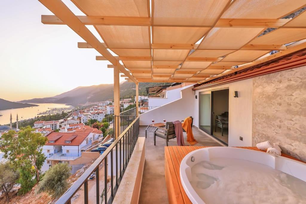 a bath tub on the balcony of a house at Mare Vista Apart in Kaş