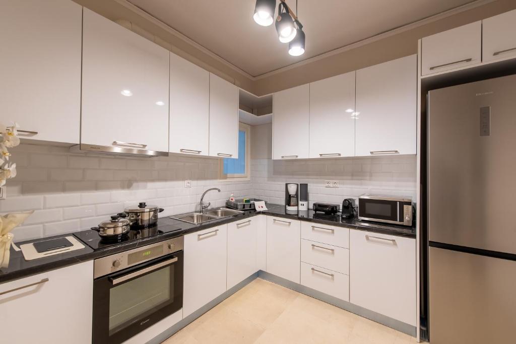 Kuchyň nebo kuchyňský kout v ubytování MEDLUXE LUXURY APARTMENT !