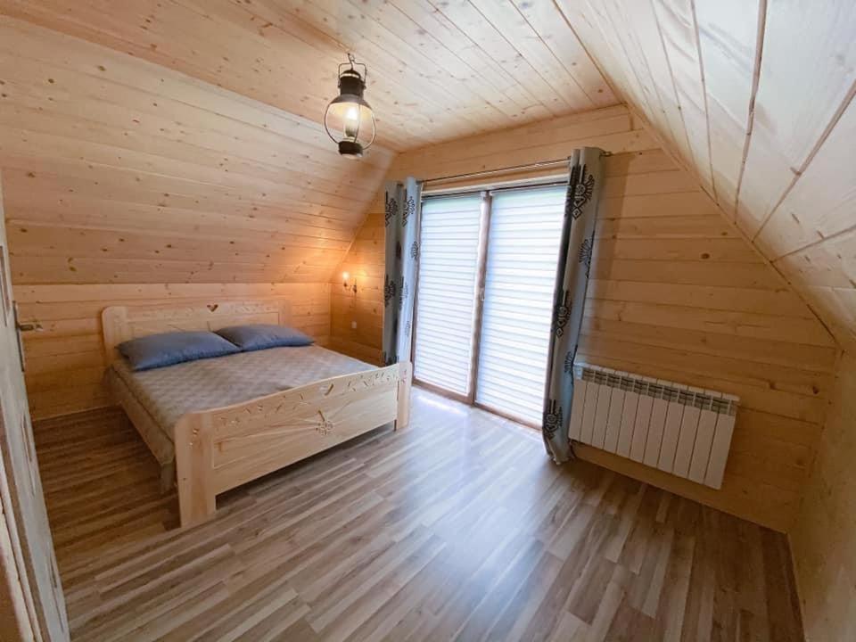 Posteľ alebo postele v izbe v ubytovaní Domek u Hajdy