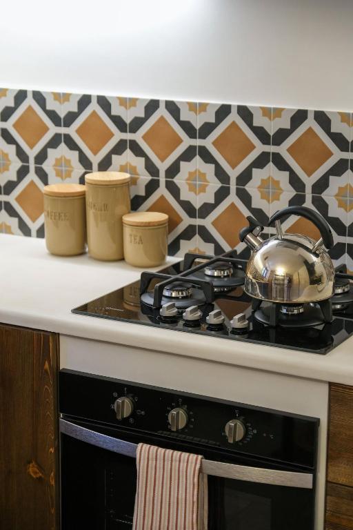 A kitchen or kitchenette at Trullo Natù - private villa