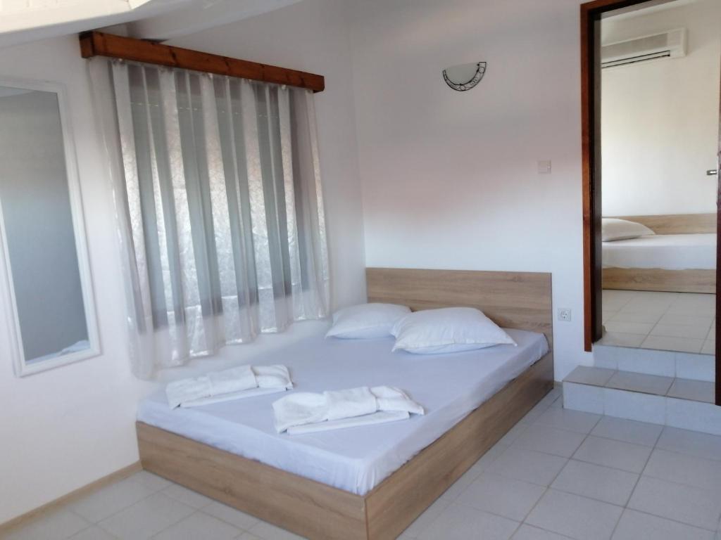 Ένα ή περισσότερα κρεβάτια σε δωμάτιο στο Ianakiev Guest House