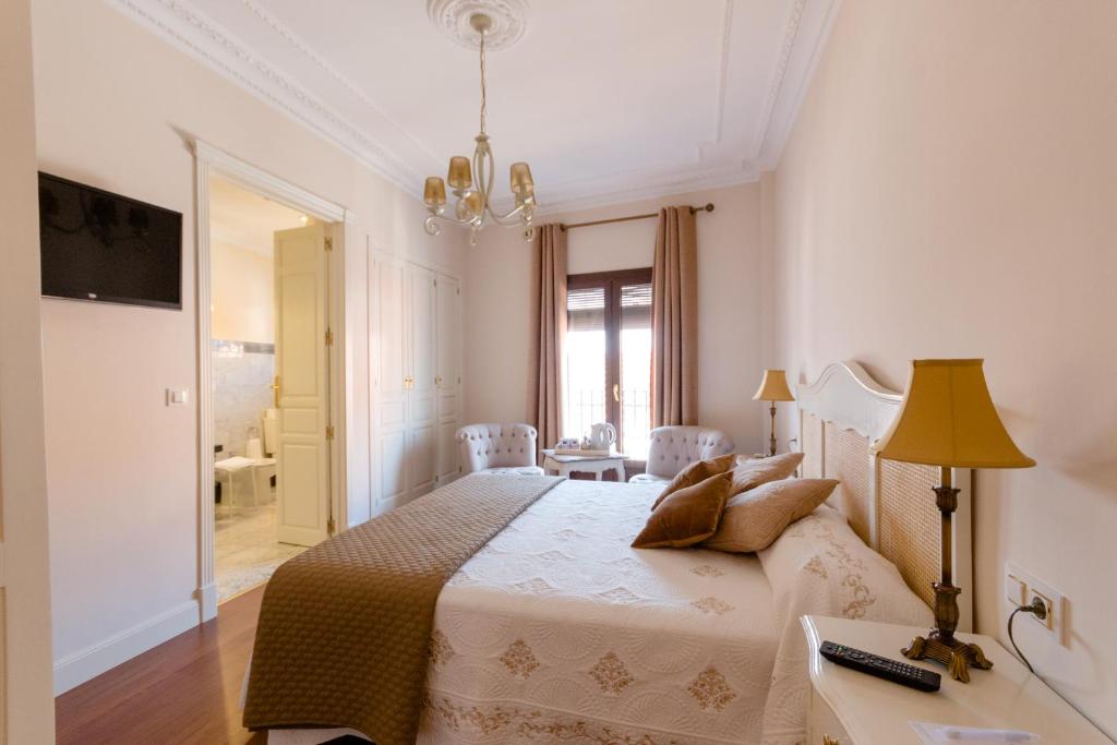 Ένα ή περισσότερα κρεβάτια σε δωμάτιο στο CASA RURAL BOUTIQUE REQUIES 5*