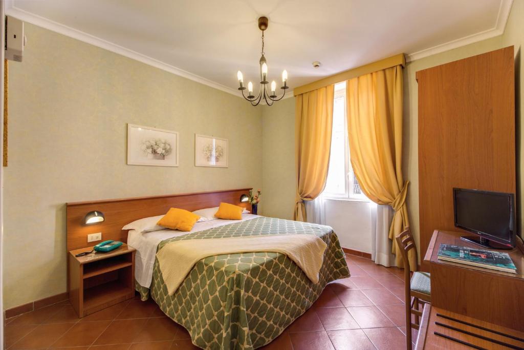 Postel nebo postele na pokoji v ubytování Hotel Corona