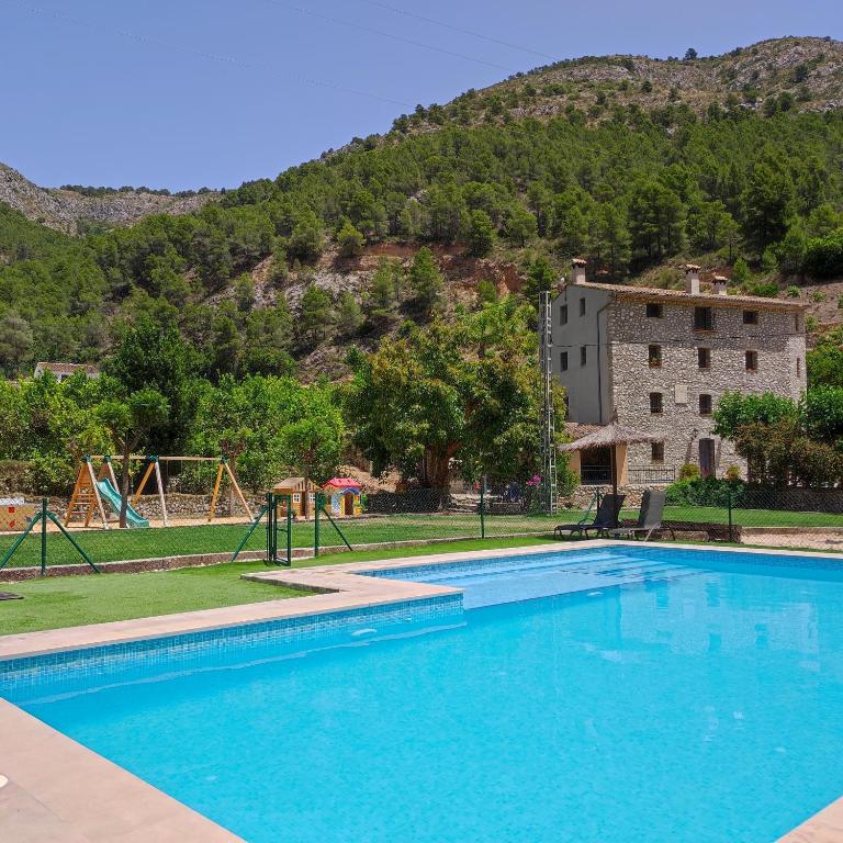 The swimming pool at or close to El Molinet del Governador- Apartamentos Rurales