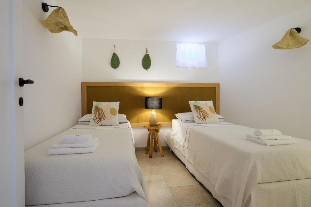 A bed or beds in a room at Trullo Natù - private villa