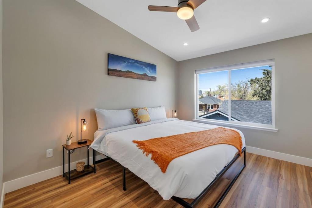 a bedroom with a large bed and a window at Midtown Retreat Quiet, Work Friendly, and Mtn Views in Reno