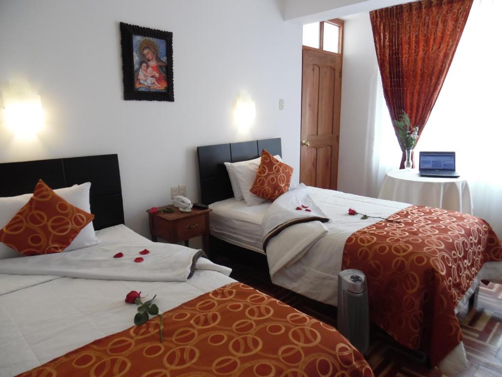 Postel nebo postele na pokoji v ubytování Hotel Puno Terra