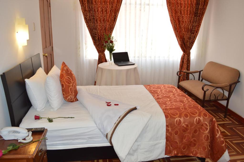 Postel nebo postele na pokoji v ubytování Hotel Puno Terra