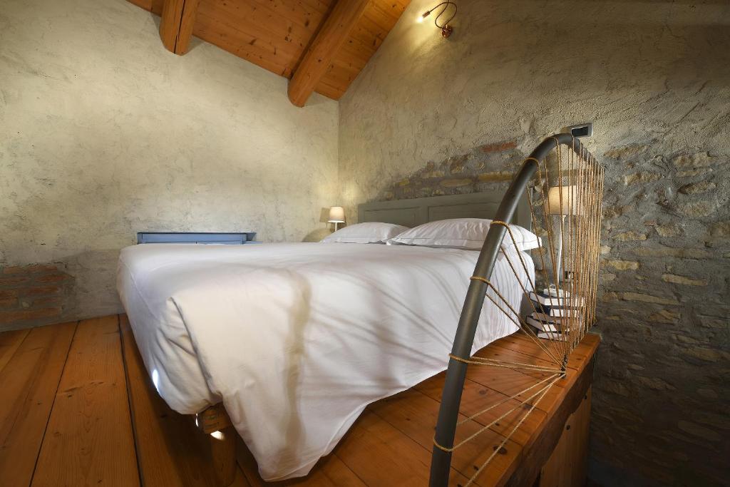 Letto o letti in una camera di Cà 'd Calin Casa nel Borgo