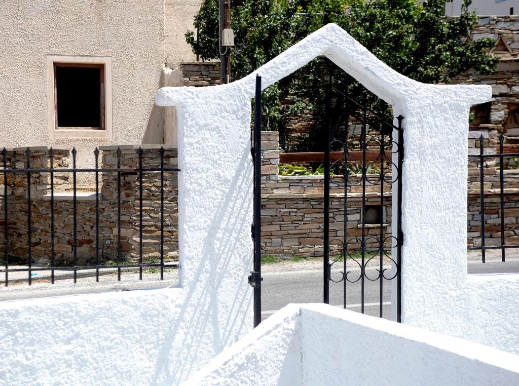 a black gate with a white curtain on it at Ios Penelope in Ios Chora