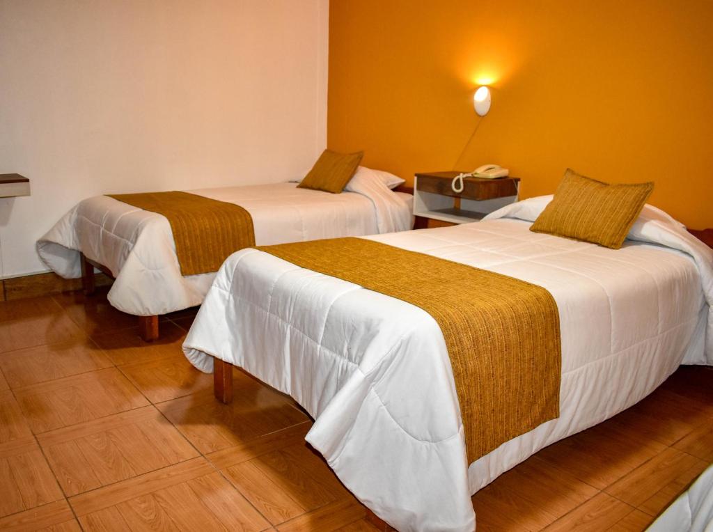 Postel nebo postele na pokoji v ubytování Hotel del Sur