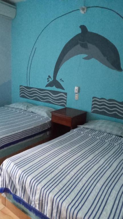 Postel nebo postele na pokoji v ubytování Hotel Lu'um