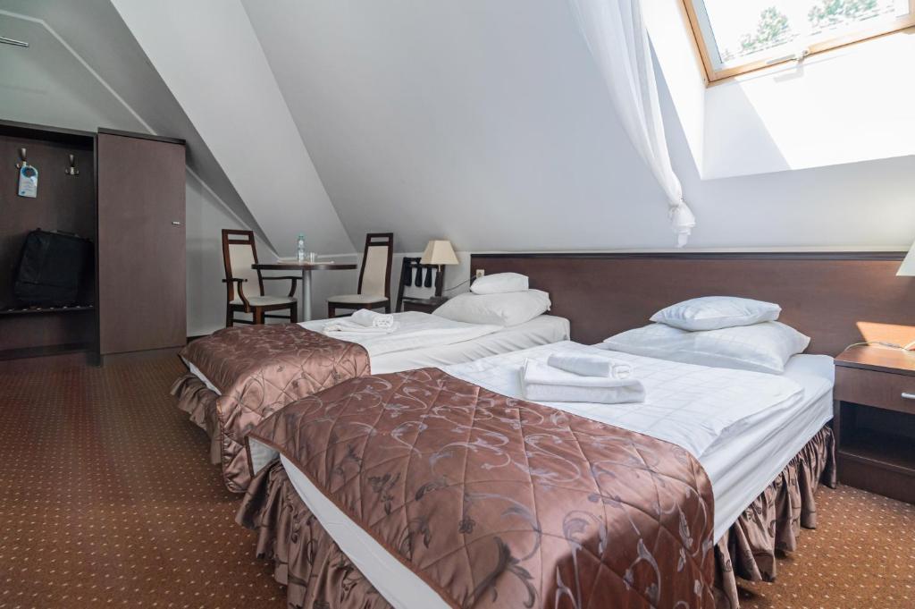 Llit o llits en una habitació de Hotel Pod Filarami