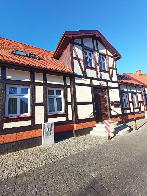 a building with a brown and white building at Apartamenty w Ustce in Ustka