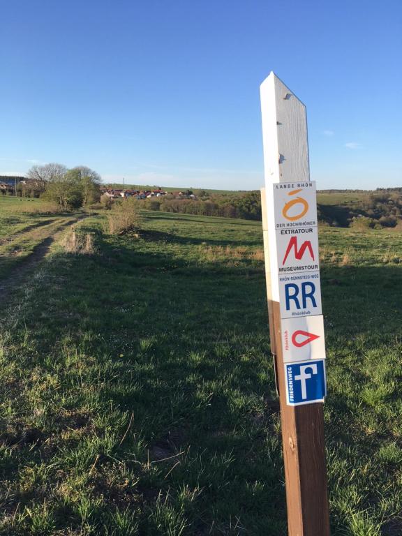 a sign in the middle of a field at Rhöner Sternenhimmel in Frankenheim
