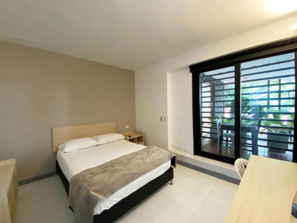 Voodi või voodid majutusasutuse Ayenda 1224 Pixel House toas