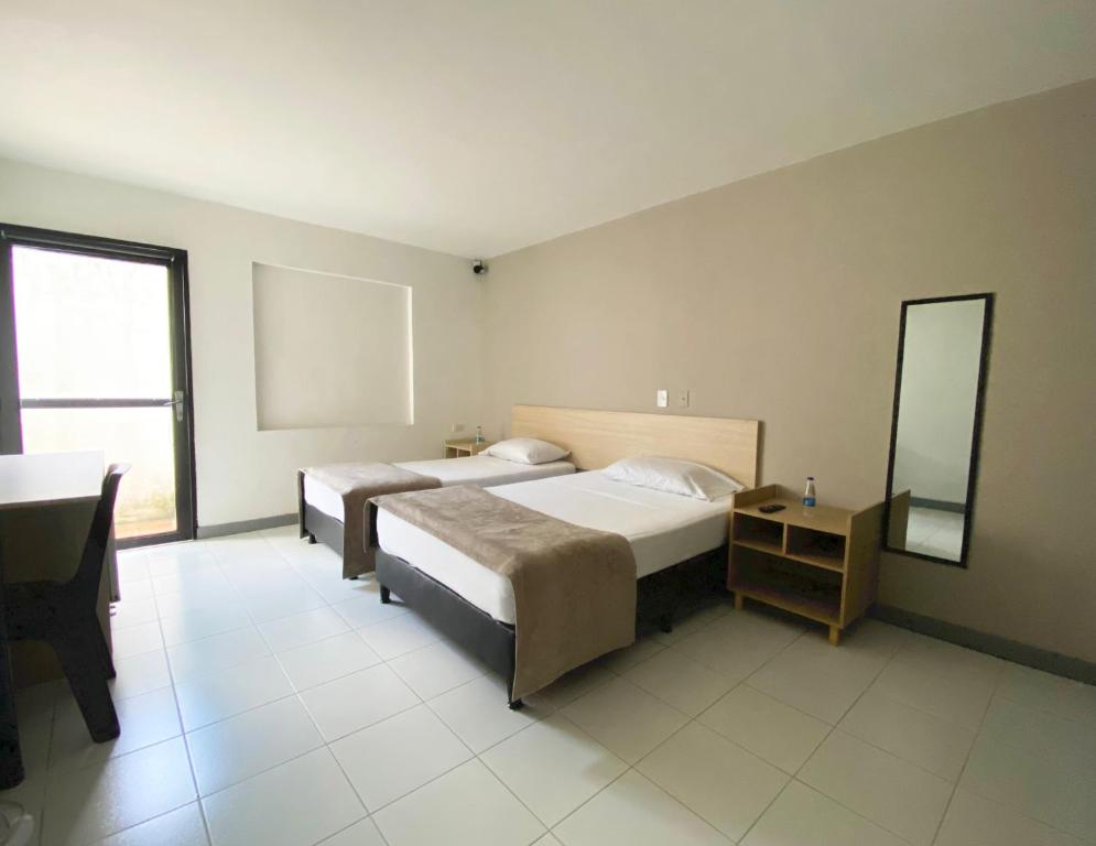 Voodi või voodid majutusasutuse Ayenda 1224 Pixel House toas