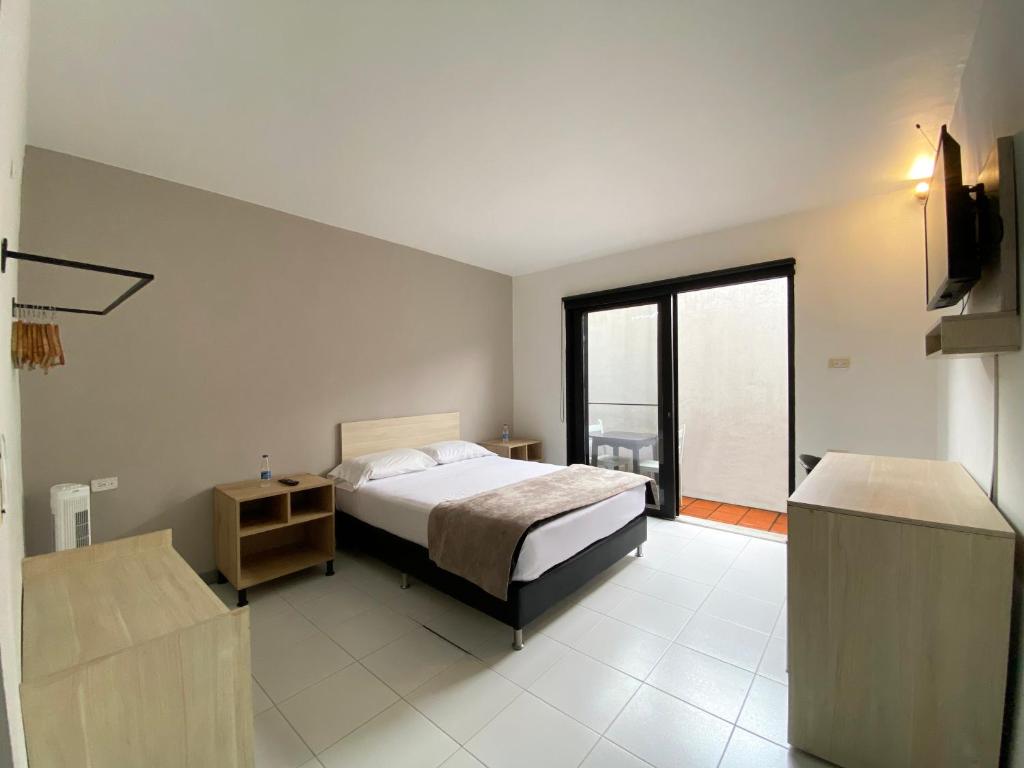 Voodi või voodid majutusasutuse Ayenda 1224 Pixel House toas