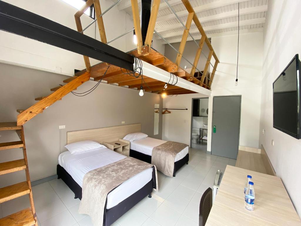 Voodi või voodid majutusasutuse Ayenda 1224 Pixel House toas