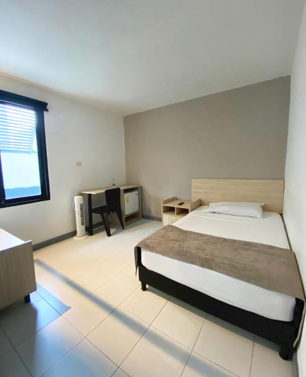 Voodi või voodid majutusasutuse Ayenda 1224 Pixel House toas