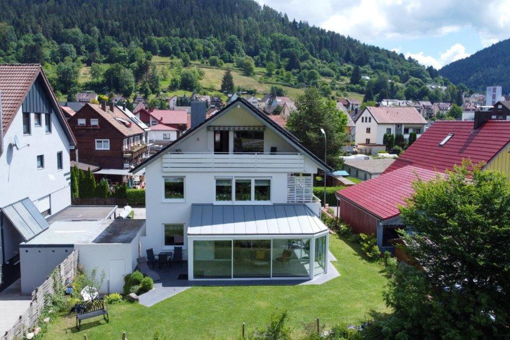 an aerial view of a house in a town at Ferienwohnung am Enzufer mit Balkon in Bad Wildbad im Schwarzwald in Bad Wildbad