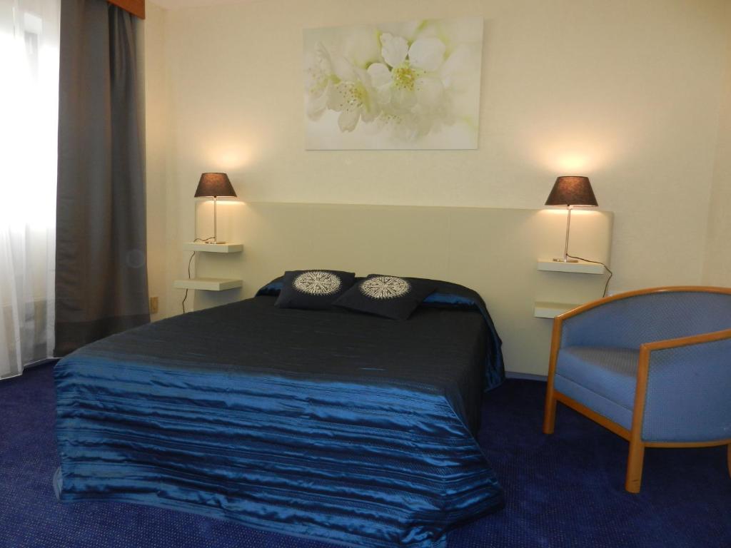 Cama o camas de una habitaci&oacute;n en Hotel Dupleix