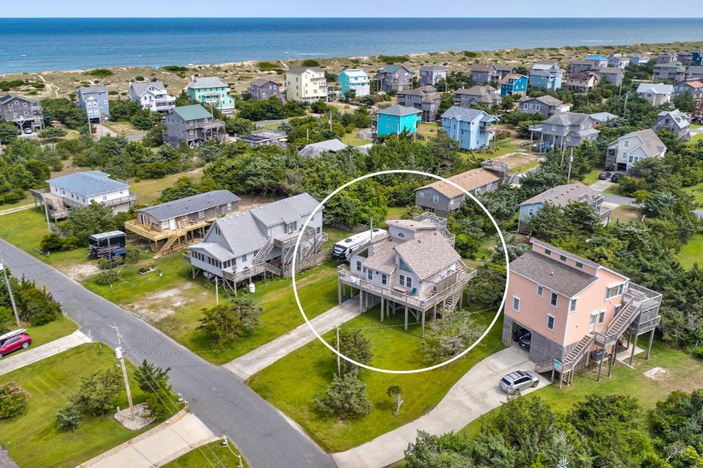 an aerial view of a neighborhood with houses and the ocean at Sunny Daze SO08 in Salvo