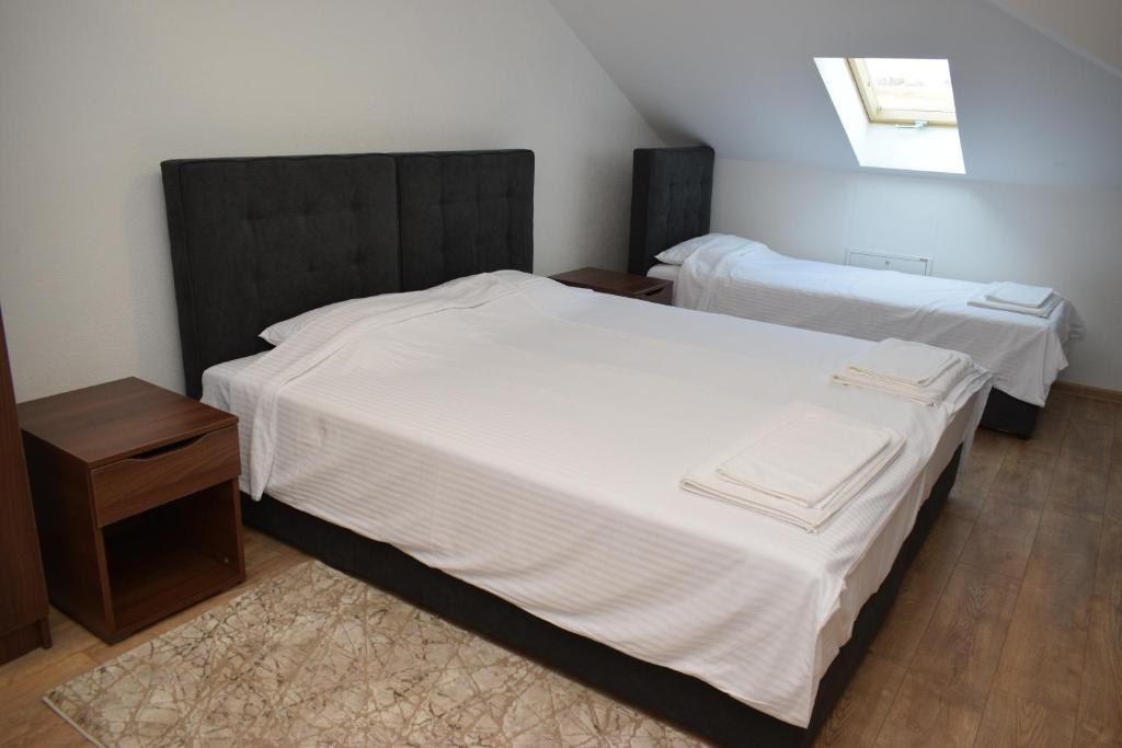 Postel nebo postele na pokoji v ubytování Spa Koncept-Apartmani