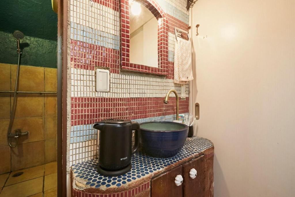 a bathroom with a sink and a mirror at ABURA HAUS - Vacation STAY 13195 in Tokyo