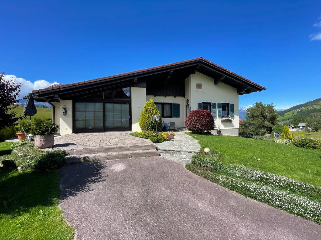 a house with a driveway in front of it at Ferienhaus Reiter in Schladming