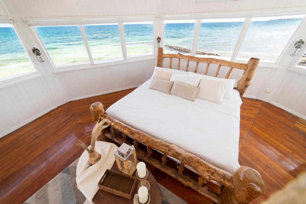 Postel nebo postele na pokoji v ubytování Quinta del Mar Crystal Beach