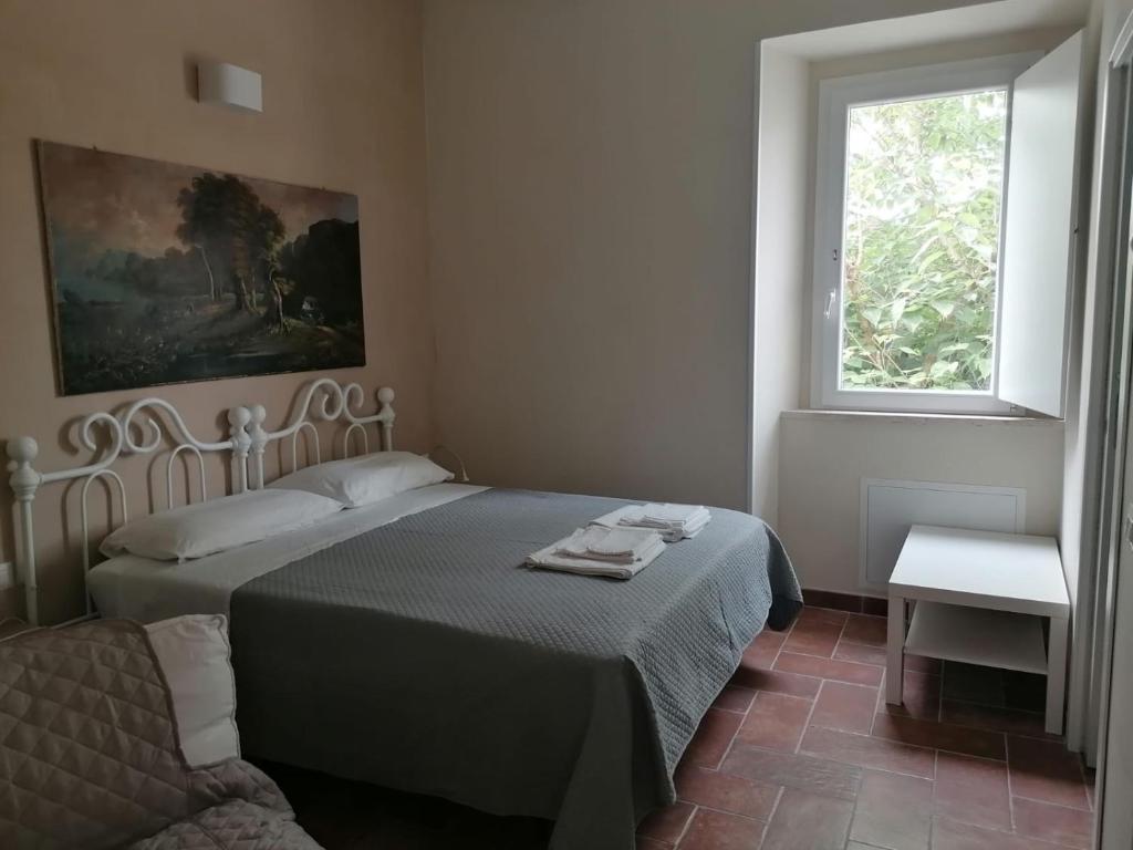 Postel nebo postele na pokoji v ubytování Borgo Bruno