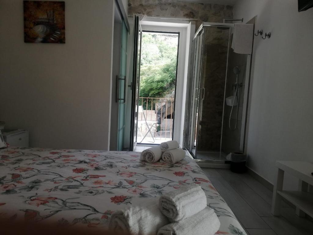 Postel nebo postele na pokoji v ubytování Il Daviduccio ibla