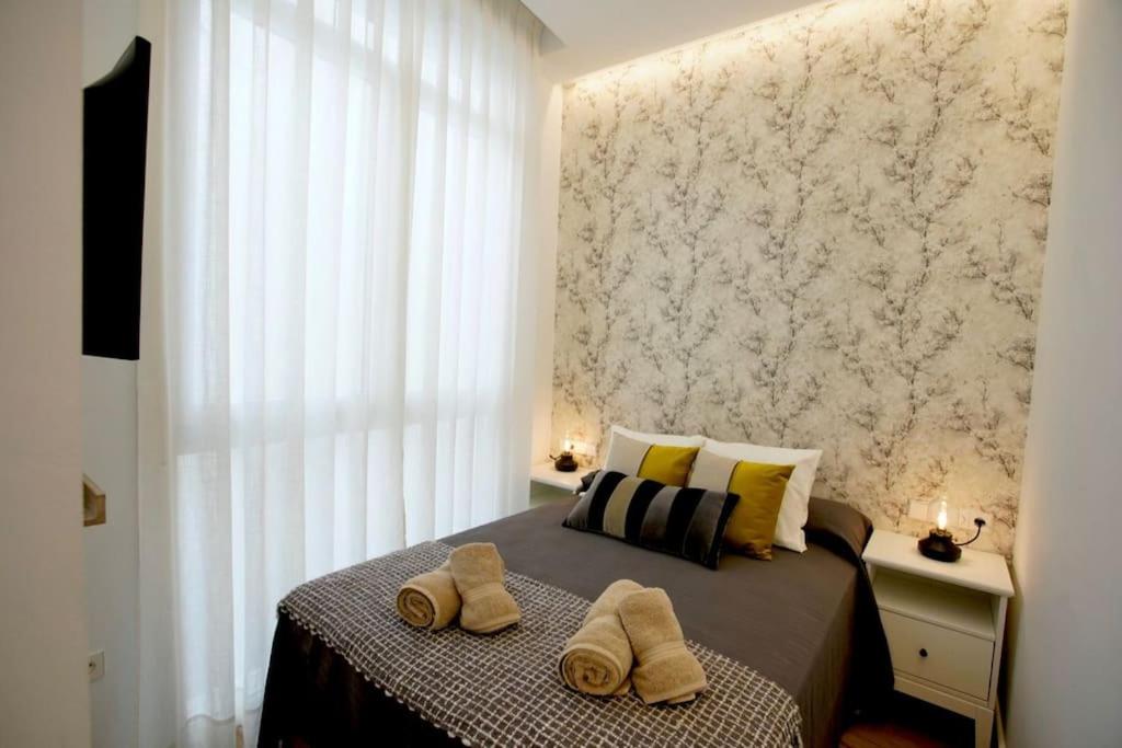 Posteľ alebo postele v izbe v ubytovaní Mini hotel in the heart of Sevilla for exclusive usage