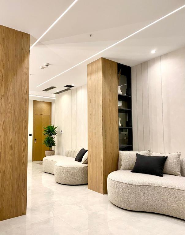 a lobby with two couches in a room at ELMAR HOTEL in Vlorë