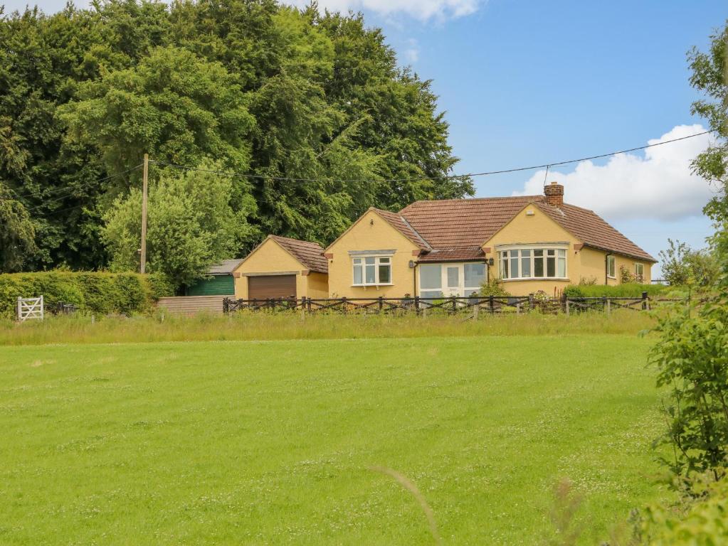 a house with a large lawn in front of it at Hill View in Darlington