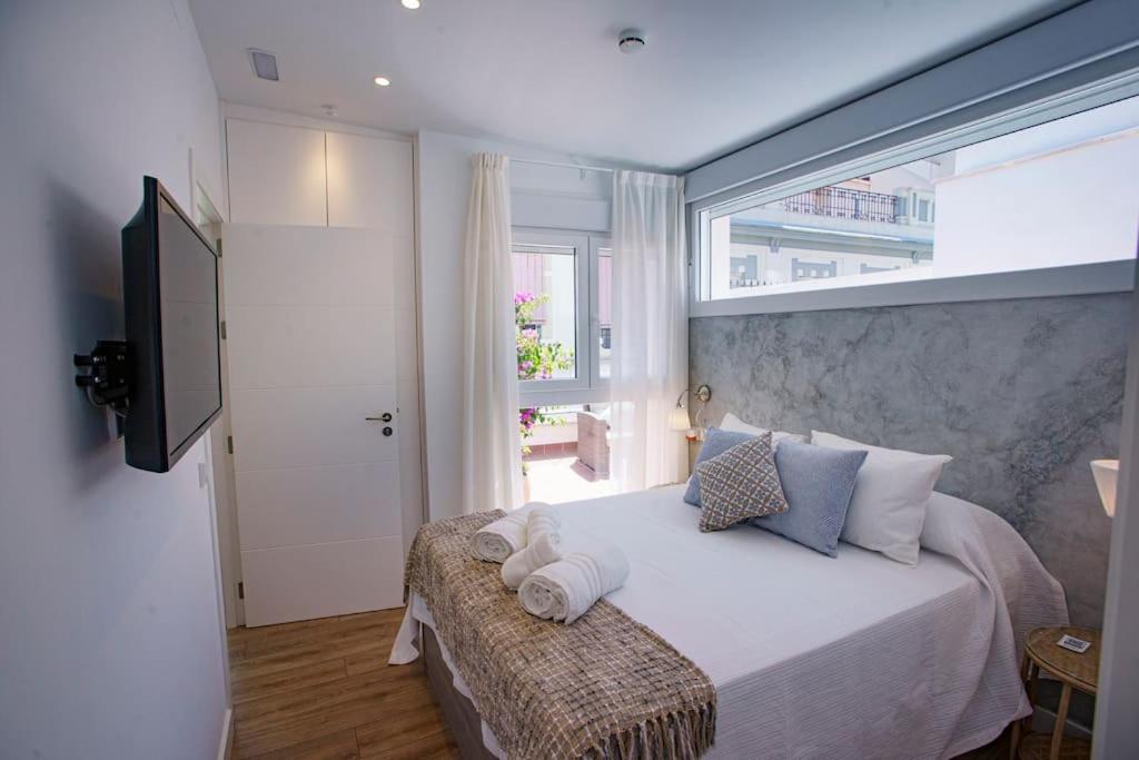 Posteľ alebo postele v izbe v ubytovaní Mini hotel in the heart of Sevilla for exclusive usage