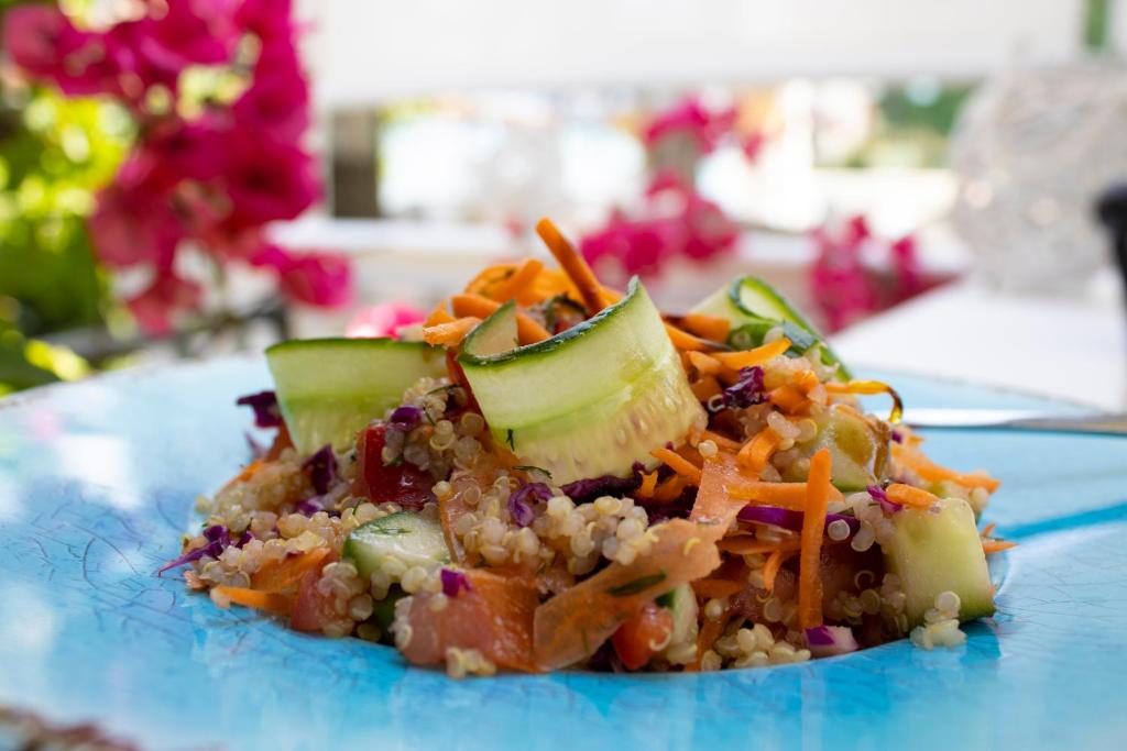 a blue plate of food with vegetables and rice at Armata Boutique Hotel in Spetses