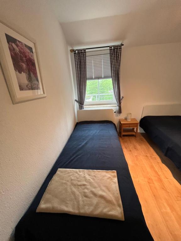 Postel nebo postele na pokoji v ubytování Gorch-Fock-Straße 2