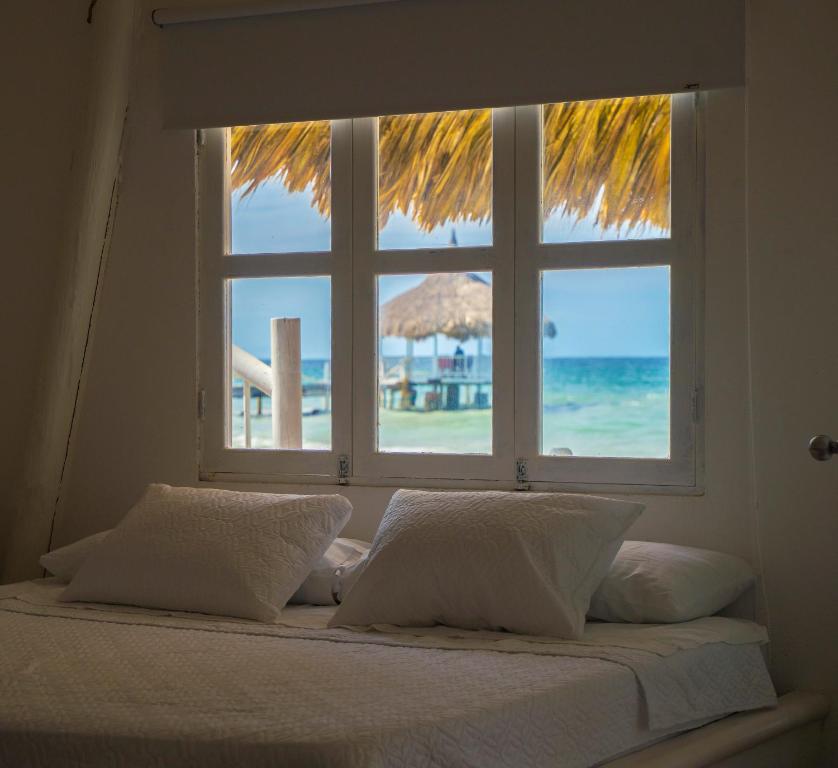 Postel nebo postele na pokoji v ubytování Quinta del Mar Crystal Beach