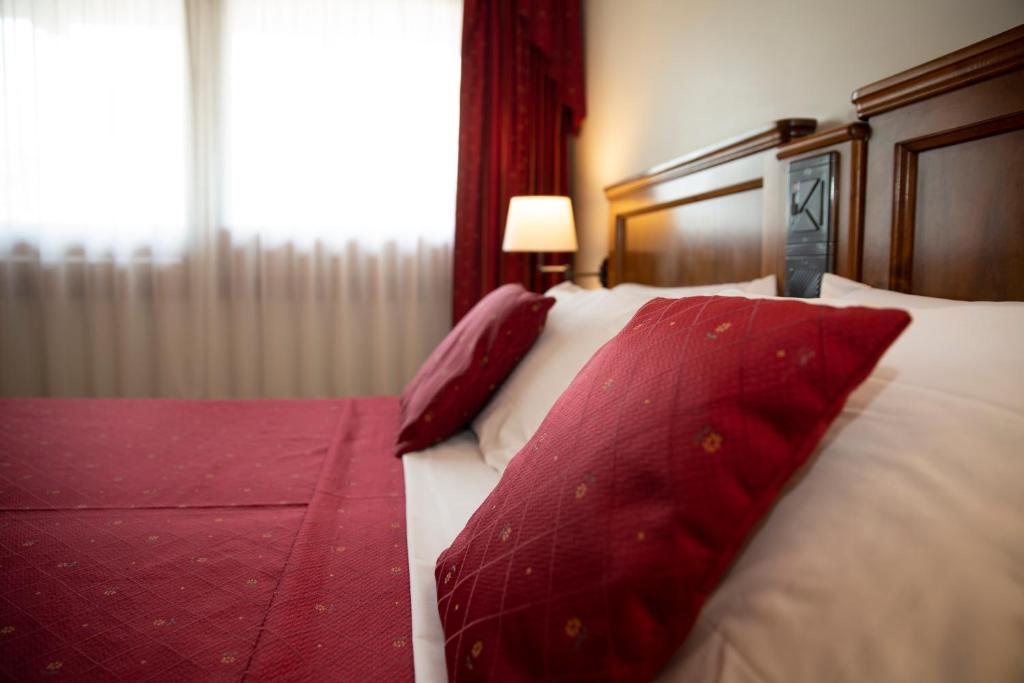 Postel nebo postele na pokoji v ubytování Hotel Ristorante Fior