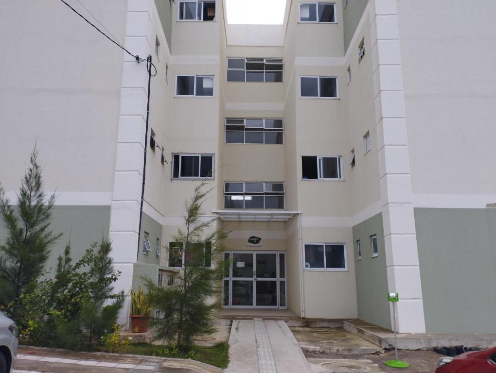 an apartment building with the front door open at Apto Charmoso Bosque Heliópolis in Garanhuns